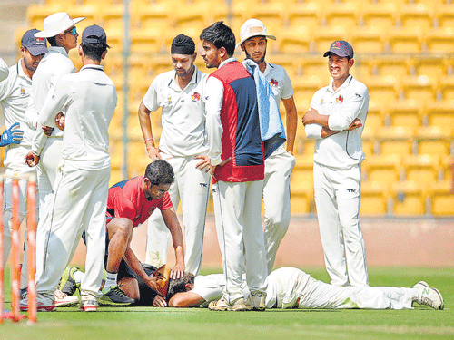 Mumbai's Abhishek Nayar gets treatment after he suffered an injury on Wednesday. DH photo