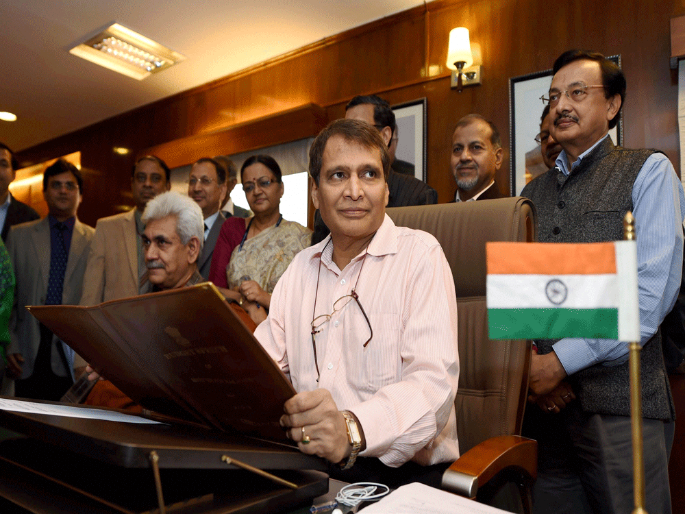 Minister Suresh Prabhu was set to present his maiden railway budget in the Lok Sabha Thursday amid expectations that his proposals will re-energise one of the largest railroad networks in the world, while seeking to improve passenger amenities and safety. PTI File Photo.