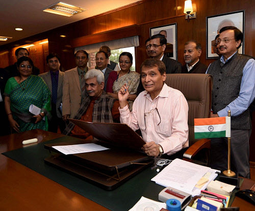 Railway Minister Suresh Prabhu today spared passengers from any hike in fares but made changes in freight rates to rake in more money while ruling out privatisation. PTI File Photo.