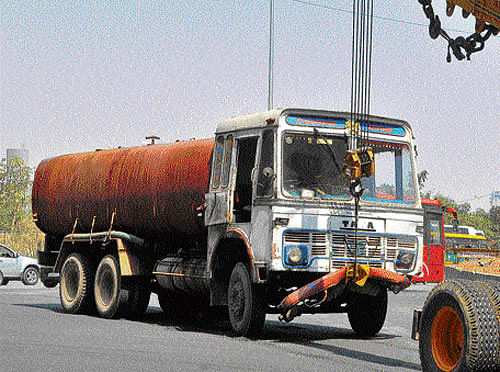 The monster tanker: A crane tows the water tanker that ploughed into a group of people near Hebbal on Thursday, killing two of them. The tanker was being driven rashly, showing just how cut-throat and ill-regulated the business has become. DH photo
