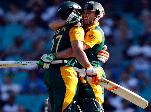 South Africa's captain AB de Villiers congratulates team mate Rilee Rossouw after he made his fifty during their Cricket World Cup match against the West Indies at the SCG. Reuters photo