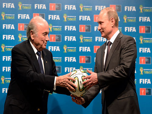 ball is in your court... FIFA President Sepp Blatter (left) with Russian President Vladimir Putin. With ruble crashing and building costs spiralling, there are concerns about the next World Cup, scheduled to be held in Russia in 2018. AP Photo.