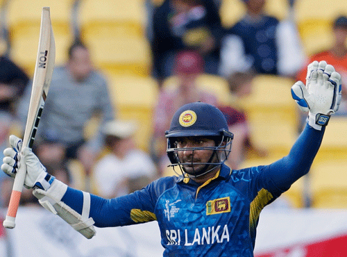 Sri Lanka's Sangakkara celebrates reaching his century during their Cricket World Cup match against England. Reuters file photo