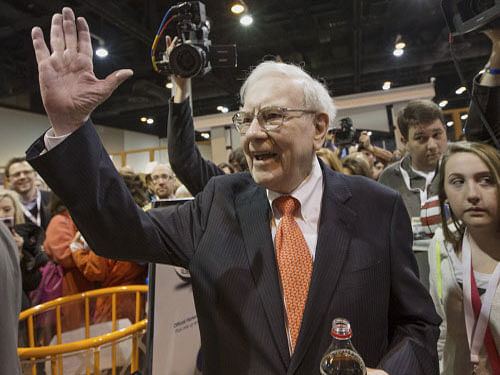 Warren Buffett, Berkshire Hathaway chairman & CEO, said there's no horse race to run between India-born top insurance executive Ajit Jain and Greg Abel, head of Berkshire's energy companies, as his possible successors. AP file photo