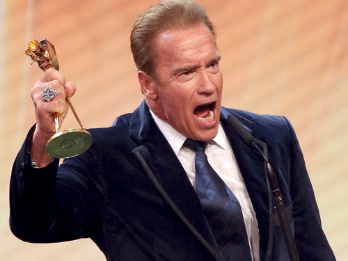 Actor Schwarzenegger holds his award for life's work at the 'Die Goldene Kamera' (Golden Camera) awards ceremony in Hamburg. Reuters Photo