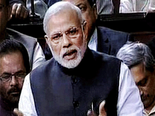 Prime Minister Narendra Modi speaks in the Rajya Sabha in New Delhi on Tuesday. PTI Photo / TV GRAB