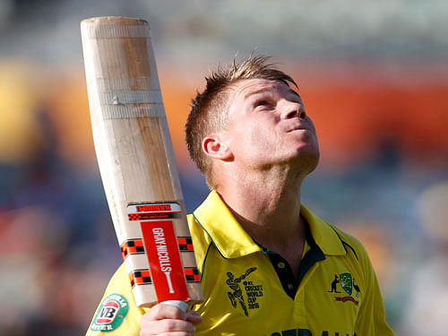 Australia's David Warner looks skyward as he walks back to the pavilion following his dismissal after scoring 178 runs during their Cricket World Cup Pool A match against Afghanistan in Perth, Australia. AP Photo.