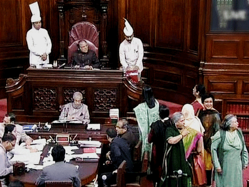 SP members protest in the Rajya Sabha in New Delhi on Wednesday. PTI Photo / TV GRAB