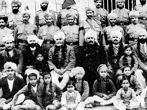 (Second row, from left) Jogindar (second), Surindar (third) and Rai Sahib Gokal Chand&#8200;(fourth). Sita Bhateja is sitting cross-legged in front&#8200;(second from right). The picture was taken in 1931 at Multan Jail.