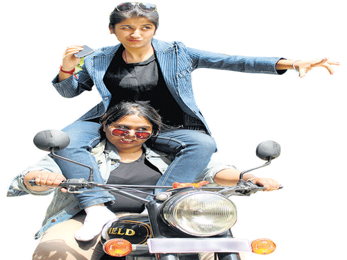Richa Kapoor and Sumukhi (riding the bike).