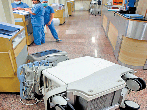 MOB FURY Medical equipment worth lakhs of rupees were damaged at Bhagwan Mahaveer Jain Hospital after the relatives of Alla Babby (inset), who&#8200;died of swine flu, went on a rampage in Bengaluru on Saturday. DH Photos