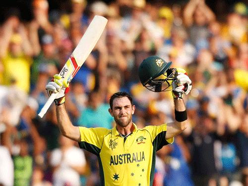 Australia's Glenn Maxwell celebrates reaching his century during their Cricket World Cup match against Sri Lanka in Sydney, March 8, 2015. REUTERS
