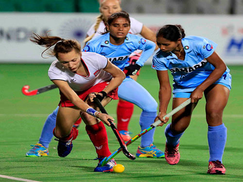 Indian (blue) and Poland's players in action during the FIH hockey world league round-II (Women) match, in New Delhi on Sunday. PTI Photo