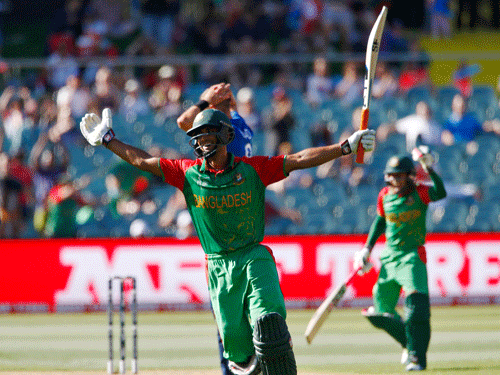 Bangladesh batsman Mohammad Mahmudullah reacts after scoring his nation's first ever century in a world cup during their Cricket World Cup match against England in Adelaide. Reuters Photo