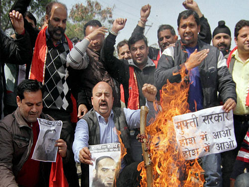 Activists of Kranti Dal shout slogans and burn an effigy of J & K Chief Minister Mufti Mohammed Sayeed during a protest over the release of separatist leader Masrat Alam Bhat, in Jammu on Monday. PTI