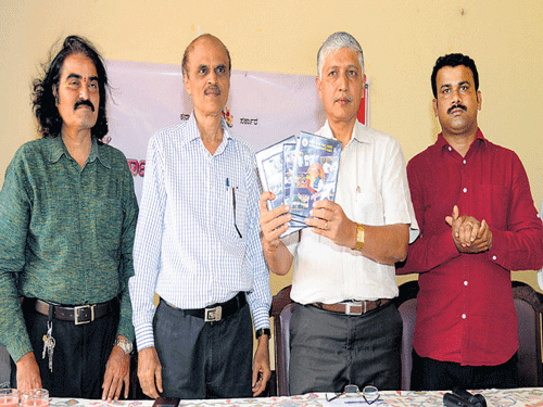 Karnataka Konkani Sahitya Academy President Roy Castellino releases a CD at a press conference at Woodland Hotel in Mangaluru on Monday. DH Photo