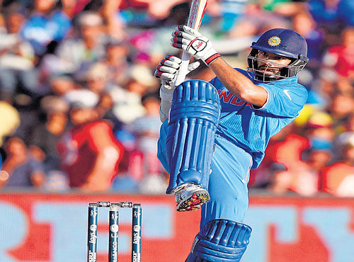 FETCH THAT!: India's Shikhar Dhawansmacks one to the boundary during his blistering century against Ireland. AFP