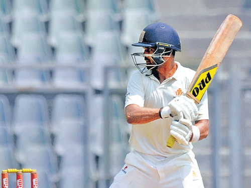 stand and deliver: Karnataka's R Vinay Kumar en route his knock of 105 against Tamil Nadu in their Ranji Trophy final tie on Wednesday. dh photo/ kishor kumar bolar