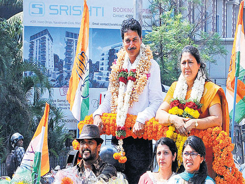 Newly elected Mayor Jacintha Vijaya Alfred and Deputy Mayor Purushotham is taken out on a procession after election in Mangaluru on Thursday. dh photo