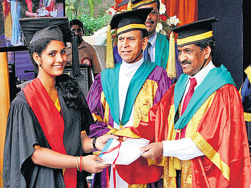A graduate was conferred the degree by Rajiv Gandhi University of Health Sciences, Vice Chancellor Dr K S Ravindranath. DH Photo
