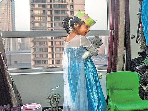 A CHILDHOOD LOST: Jessica Cherry in her bedroomin Beijing. Jessica is in administrative limbo because her parents did not obtain a mandatory birth permit, making it impossible for her to acquire a Chinese passport and other documents that define citizenship there. NYT