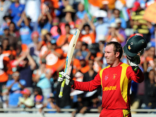 Zimbabwe batsman Brendan Taylor acknowledges the crowd as he leaves the field after he was dismissed for 138 runs during their Cricket World Cup Pool B match against India in Auckland, New Zealand, Saturday, March 14, 2015. AP Photo