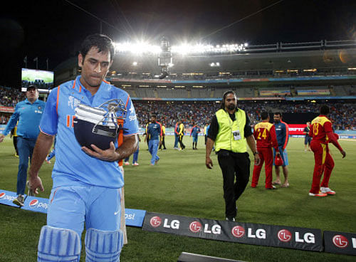 Dhoni leaves the field after winning their Cricket World Cup match against Zimbabwe at Eden Park in Auckland. Reuters photo