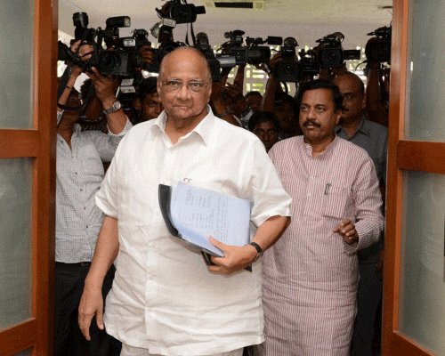 An NCP delegation, led by party president Sharad Pawar, today met former Prime Minister Manmohan Singh, who has been issued a court summon in a coal block allocation scam case, and offered their unstinted support to him. PTI File Photo