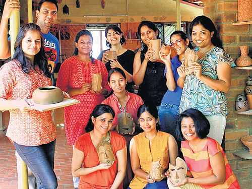 CREATIVE Clay artists with their products.