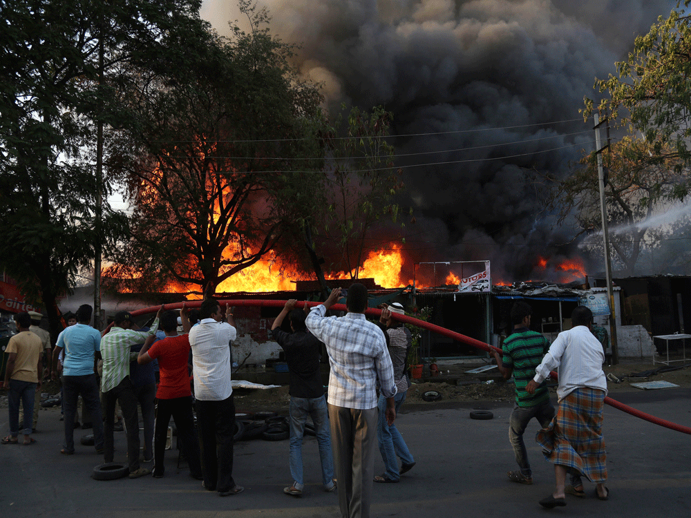 A lorry today caught fire following which about 60 LPG cylinders kept in it exploded, leading to tense moments in Andhra Pradesh's Kurnool district. AP file photo. For representation purpose