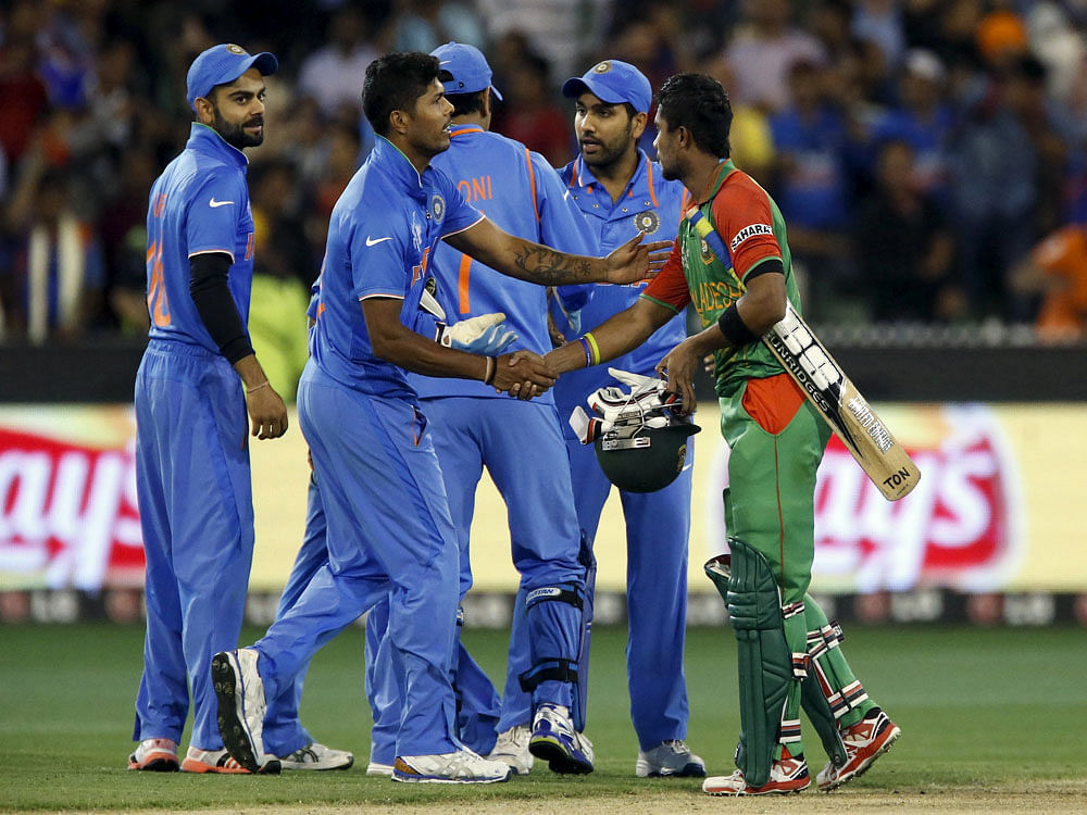 Bangladesh batsman Sabbir Rahman shakes hands with players from India at end of their Cricket World Cup match in Melbourne. Reuters Photo.
