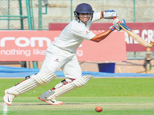 delightful: Karnataka's Karun Nair en route his 80 against Rest of India on day three of their Irani Cup tie in Bengaluru on Thursday. dh photo/ Srikanta Sharma R