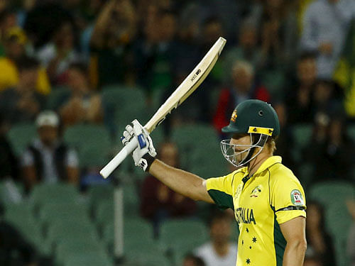 Australian batsman Watson acknowledges his 50 runs during his Cricket World Cup quarter final match against Pakistan in Adelaide. Reuters image