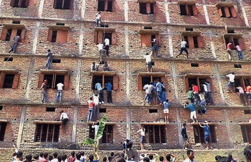Incidents of cheating in the Class 10 exam continued in Bihar on Saturday with police even having to fire in the air and carry out a baton charge to disperse a large number of people helping students to copy, an official said. PTI file photo