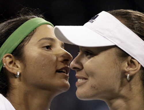 Martina Hingis and Sania Mirza have completed a dream first tournament together, beating Ekaterina Makarova and Elena Vesnina 6-3, 6-4 to win the BNP Paribas Open women's doubles title here. AP file photo
