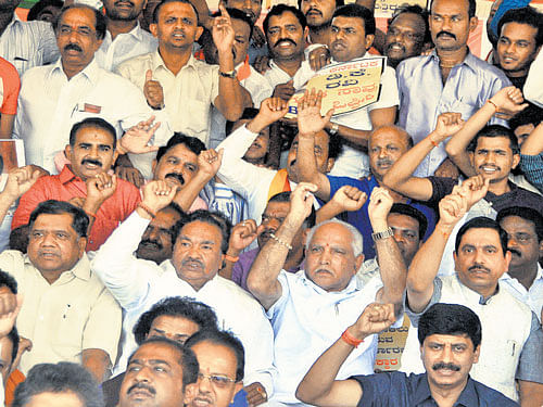 mounting pressure: BJP leaders Jagadish Shettar, K&#8200;S Eshwarappa, B S Yeddyurappa and party's State  President Pralhad Joshi stage a protest in Bengaluru on Sunday. dh Photo