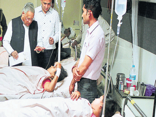 UP Health Minister Ahmad Hasan distributes compensation  to the victims at Lucknow Trauma Centre on Sunday. PTI