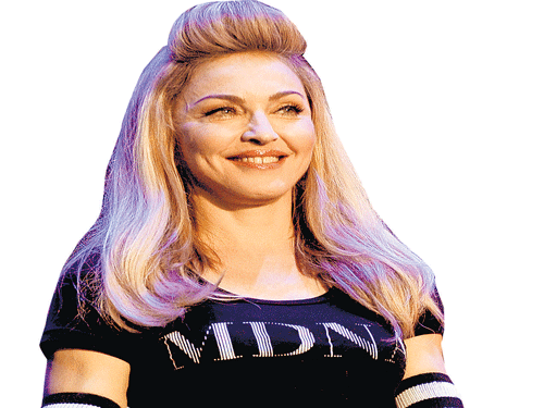 Wild child Madonna's raw charisma still makes the crowd dance to her tunes.