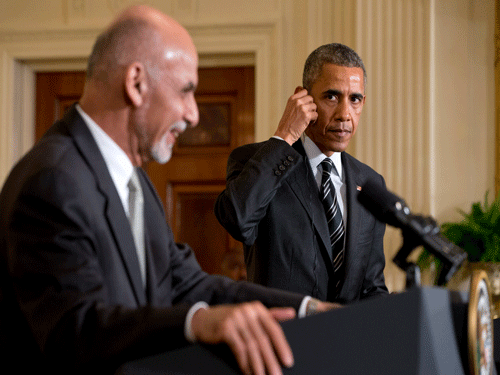 President Barack Obama listens to translation during his joint news conference with Afghanistan's President Ashraf Ghani, Tuesday, March 24, 2015, in the East Room of the White House in Washington. AP Photo