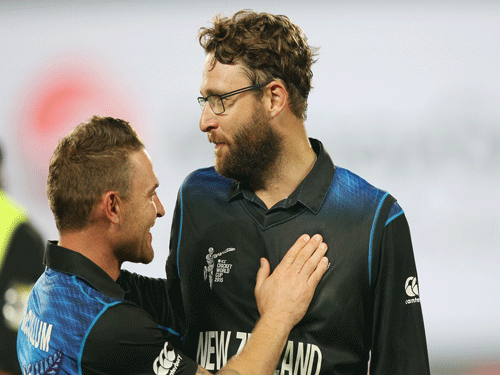 New Zealand captain Brendon McCullum and teammate Dan Vettori, right, chat following their four wicket win over South Africa in their Cricket World Cup semifinal in Auckland, New Zealand, Tuesday, March 24, 2015. AP Photo