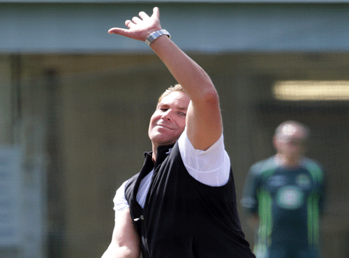 Australia's Shane Warne bowls during batting practice for the Cricket World Cup in Sydney, Australia, Wednesday, March 25