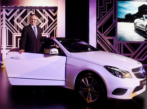 Eberhard Kern, CEO, Mercedes Benz, India, launches the New E-Class Cabriolet in New Delhi on Wednesday.PTI Photo