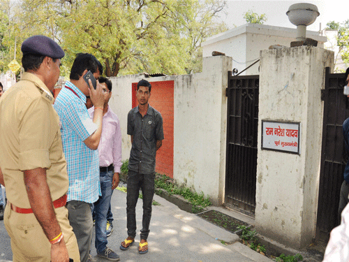 Police personnel inspect outside the residence of Madhya Pradesh Governor Ram Naresh Yadav after his son Shailesh Yadav committed suicide, in Lucknow on Wednesday. PTI Photo