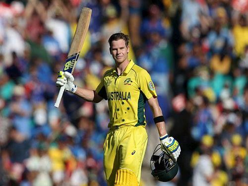 Australia's batsman Steve Smith acknowledges the crowd after scoring his century during his Cricket World Cup semi-final match against India in Sydney, March 26, 2015. REUTERS