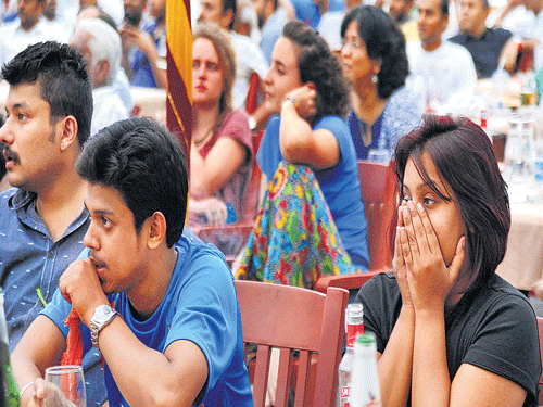 Dejected  Cricket fans, who had gathered at the Bowring Institute to watch the India-Australia World Cup semi-final on Thursday, were heartbroken as Indian wickets started tumbling. DH photo