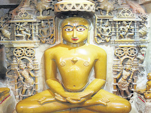 temple trail (Clockwise from top left) Statues at Gopachal Parvat, Gwalior; Saavira Kambada Basadi at Moodabidri, Karnataka; Panamaram Jain Temple at Wayanad, Kerala; a 'tirthankara' idol at a Jain temple in Jaisalmer. Photos by authors.