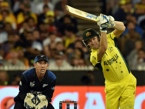 Michael Clarke plays a shot as New Zealand's wicketkeeper Luke Ronchi (L) looks on during the 2015 Cricket World Cup final between Australia and New Zealand in Melbourne. AFP
