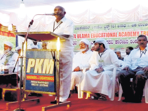 Former Member of Parliament H Vishwanath speaks after laying foundation for a degree college at Perumbade near Virajpet. DH PHOTO