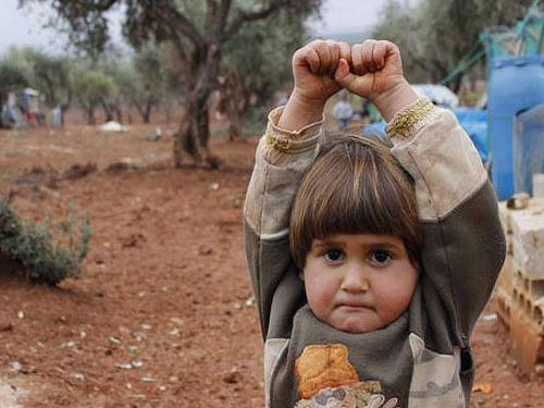 This image of a Syrian kid in a surrendering position reveals the painful impact of wars on a child's mind.Image courtesy: Twitter