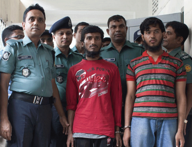 Bangladesh police officials parade suspects before media representatives in Dhaka on March 30, 2015, after blogger Washiqur Rahman was hacked to death in the capital. AFP photo